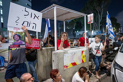 Israel-Hamas war: Families of hostages held in Gaza protest in front of the Independence Hall in Tel Aviv